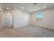 Spacious bedroom with plush carpet, a bright window, and access to the hallway and closet at 756 Sleeping City Ave, Henderson, NV 89015