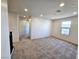 Bright bonus room featuring neutral carpet, recessed lighting, and a window overlooking the neighborhood at 756 Sleeping City Ave, Henderson, NV 89015