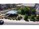 Aerial view of a community park featuring covered picnic tables, mature landscaping, and walking paths at 756 Sleeping City Ave, Henderson, NV 89015