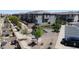 Aerial view of a Gathering-friendly community featuring a playground, walkways, landscaping, and well-maintained townhomes at 756 Sleeping City Ave, Henderson, NV 89015