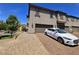 Townhouse exterior featuring a private driveway, attached garage, and well-maintained landscaping and a shared playground at 756 Sleeping City Ave, Henderson, NV 89015