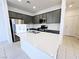 Modern kitchen featuring stainless steel appliances and a quartz-topped island at 756 Sleeping City Ave, Henderson, NV 89015