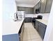 Modern kitchen with stainless steel appliances, quartz countertops, tile backsplash, and updated fixtures at 756 Sleeping City Ave, Henderson, NV 89015