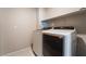 This laundry room includes modern side-by-side white washer and dryer appliances at 756 Sleeping City Ave, Henderson, NV 89015