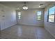 Spacious living area with bright natural light and neutral tile flooring at 756 Sleeping City Ave, Henderson, NV 89015