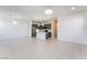 Open-concept living space with tile flooring and modern finishes, flows seamlessly into the kitchen at 756 Sleeping City Ave, Henderson, NV 89015