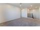 Second-floor loft area featuring plush carpet, neutral walls, and access to the staircase and hallway at 756 Sleeping City Ave, Henderson, NV 89015