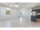 Open-concept space featuring tile flooring, modern lighting, and a kitchen island at 756 Sleeping City Ave, Henderson, NV 89015