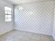 Stylish living room with a decorative wall, modern lighting, and tile flooring at 756 Sleeping City Ave, Henderson, NV 89015
