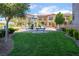 Community playground with colorful play structure and lush green lawn at 756 Sleeping City Ave, Henderson, NV 89015
