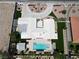 Aerial view of a modern home with lush landscaping, a pool, and a circular driveway at 7575 Coley Ave, Las Vegas, NV 89117