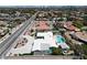 Aerial view of a modern home with lush landscaping, a pool, and a circular driveway at 7575 Coley Ave, Las Vegas, NV 89117