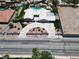 An aerial perspective showcasing the home's circular driveway, pristine landscaping, and refreshing pool at 7575 Coley Ave, Las Vegas, NV 89117
