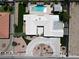 Aerial view of a modern home with lush landscaping, a pool, and a circular driveway at 7575 Coley Ave, Las Vegas, NV 89117