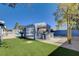 A large covered outdoor kitchen area with a BBQ and a beautiful pool at 7575 Coley Ave, Las Vegas, NV 89117