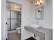 A modern bathroom featuring an ornate mirror and shower at 7575 Coley Ave, Las Vegas, NV 89117