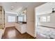 Bathroom with dual sink vanity, glass walk-in shower, and doorway to bedroom at 7575 Coley Ave, Las Vegas, NV 89117
