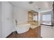 Modern bathroom features a stand alone tub, glass shower, tile floors and double sink vanity at 7575 Coley Ave, Las Vegas, NV 89117