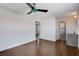 Stylish bedroom with hardwood floors, ceiling fan, and ensuite bathroom access, perfect for relaxation at 7575 Coley Ave, Las Vegas, NV 89117