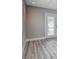 Bedroom with wood floors, a window with shutters and French doors at 7575 Coley Ave, Las Vegas, NV 89117