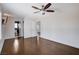 Neutral bedroom with wood floors, ceiling fan, and ensuite access at 7575 Coley Ave, Las Vegas, NV 89117