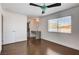 This bedroom has wood floors, a window, and an ensuite bathroom at 7575 Coley Ave, Las Vegas, NV 89117