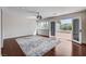 Bright bedroom with hardwood floors and an outdoor view of the pool and desert landscape, for relaxed living at 7575 Coley Ave, Las Vegas, NV 89117