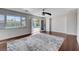 Comfortable bedroom with hardwood floors, ceiling fan, and natural light, offering a relaxing and inviting space at 7575 Coley Ave, Las Vegas, NV 89117