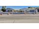 Charming single-story home featuring a decorative metal gate and desert landscaping for curb appeal at 7575 Coley Ave, Las Vegas, NV 89117