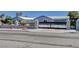 Charming single-story home featuring a custom wrought iron gate entry and desert landscaping at 7575 Coley Ave, Las Vegas, NV 89117
