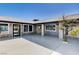 Stunning front yard featuring desert landscaping, stone accents, and a grey tile roof, creating a modern and inviting curb appeal at 7575 Coley Ave, Las Vegas, NV 89117