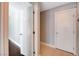 Modern hallway with stylish doors, tiled floors, and recessed lighting, creating a bright and inviting space at 7575 Coley Ave, Las Vegas, NV 89117