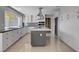 Modern kitchen with stainless steel appliances, granite countertops, large island and plenty of cabinet space at 7575 Coley Ave, Las Vegas, NV 89117