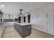 Modern kitchen features stainless steel appliances, stylish island, and abundant storage for the home chef at 7575 Coley Ave, Las Vegas, NV 89117