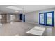 Bright, open living room with tile flooring, recessed lighting, and access to the backyard at 7575 Coley Ave, Las Vegas, NV 89117