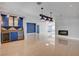 Open living room featuring a bar, wine coolers, accent lighting, and a fireplace at 7575 Coley Ave, Las Vegas, NV 89117