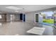 Open living space with tiled floor leading to a patio and backyard at 7575 Coley Ave, Las Vegas, NV 89117