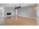 Modern living room with tile floors, fireplace, large windows, and accent lighting at 7575 Coley Ave, Las Vegas, NV 89117