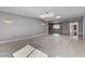 Bright living room with marble floors, recessed lights, and modern chandelier features at 7575 Coley Ave, Las Vegas, NV 89117