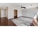Expansive main bedroom with sleek hardwood floors and a ceiling fan, offering a serene retreat at 7575 Coley Ave, Las Vegas, NV 89117