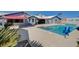 A gorgeous backyard featuring a refreshing swimming pool, patio, and lovely plants at 7575 Coley Ave, Las Vegas, NV 89117