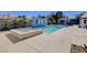 Stunning backyard pool and spa area with a built-in BBQ and lush landscaping at 7575 Coley Ave, Las Vegas, NV 89117