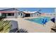 A gorgeous backyard featuring a refreshing swimming pool, patio, and lovely plants at 7575 Coley Ave, Las Vegas, NV 89117