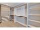 Spacious walk-in closet featuring custom shelving and ample storage options for optimal organization at 7575 Coley Ave, Las Vegas, NV 89117