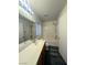 Bathroom featuring a vanity with solid surface countertop and a shower-tub combo at 7611 Avila Beach Ave, Las Vegas, NV 89113