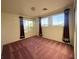 Large bright bedroom features carpeted floors and large windows to let the sunshine in at 7611 Avila Beach Ave, Las Vegas, NV 89113
