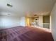 Large bonus room has a carpeted floor and neutral walls and lighting at 7611 Avila Beach Ave, Las Vegas, NV 89113