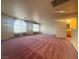 Bonus room with carpeted floor and bright windows allows for flexible living space at 7611 Avila Beach Ave, Las Vegas, NV 89113