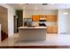 Well-lit kitchen with stainless steel appliances, a center island, and tile flooring at 7611 Avila Beach Ave, Las Vegas, NV 89113