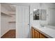 Bright bathroom features white tiled counter and floors with a closet to the left at 7898 Rye Canyon Dr, Las Vegas, NV 89123